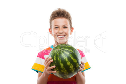 Handsome smiling child boy holding green watermelon fruit