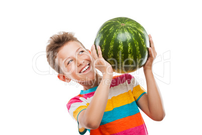 Handsome smiling child boy holding green watermelon fruit Handsome smiling child boy holding green watermelon fruit