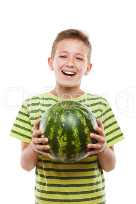 Handsome smiling child boy holding green watermelon fruit