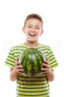 Handsome smiling child boy holding green watermelon fruit