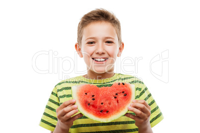 Handsome smiling child boy holding red watermelon fruit slice