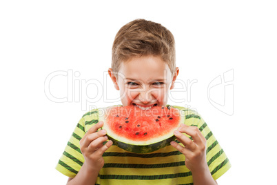 Handsome smiling child boy holding red watermelon fruit slice