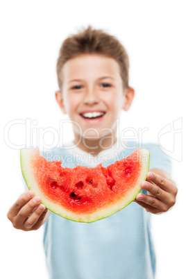 Handsome smiling child boy holding red watermelon fruit slice