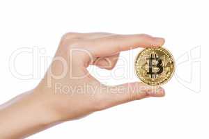 Young girl hand holding bitcoin on white