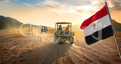 Flag and buggies in desert