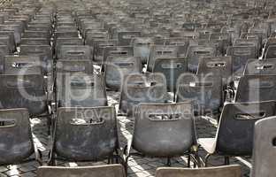 Rows of empty chairs.