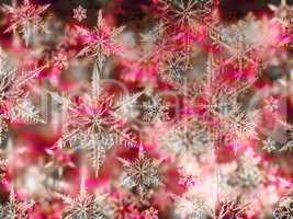 Colorful Christmas background with snowflakes and stars on a dar