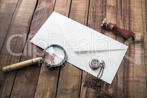 Envelope, magnifier, stamp, clock