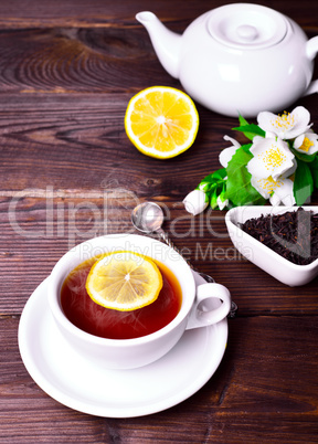 black tea in a white mug with a saucer