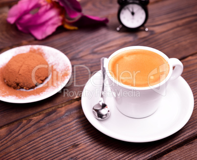 espresso in a white cup with saucer