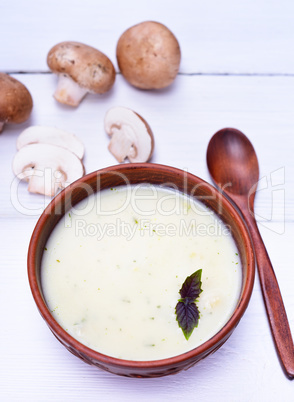 mushroom cream soup in a brown round plate