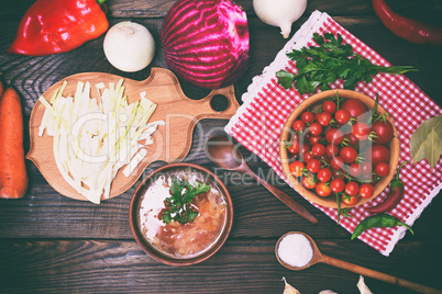 traditional Ukrainian borscht in a brown clay dish