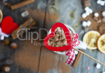 red wooden heart on background table with drink