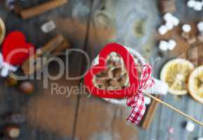 red wooden heart on background table with drink