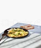 Healthy breakfast. Stewed Vegetables and eggs in a frying pan