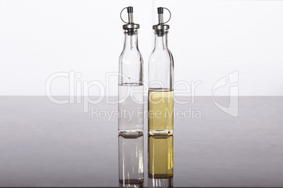 Olive oil and vinegar in bottles on a table