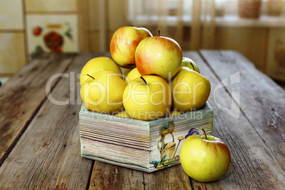 Ripe apples on a wooden table, closeup, rural style