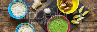 An authentic Indian dinner. Palak paneer and rice. Ginger, spices