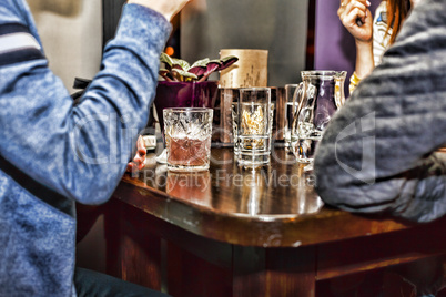 Meeting friends at the bar. Various cocktails on the bar