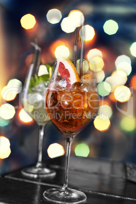 Various cocktails on the background of a colorful bokeh