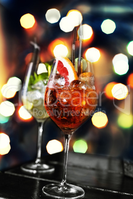 Various cocktails on the background of a colorful bokeh