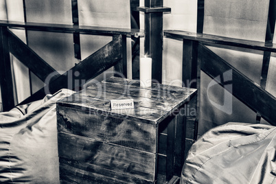 A table in a cafe with a sign reserved