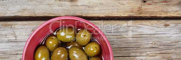 Delicious Olives on a wooden background. View from above