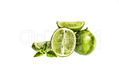 Lime. Fruit slices and mint isolated on a white background