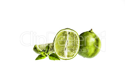 Lime. Fruit slices and mint isolated on a white background