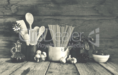 Set of raw ingredients for Italian pasta on a wooden background