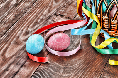 Feast of Easter, painted easter eggs, basket decorated with ribbons