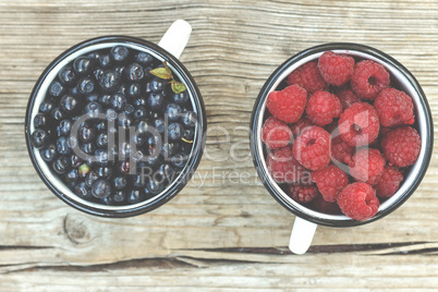 Concept: healthy food. Ripe raspberries and blueberries.