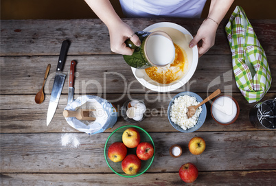 Cooking food. The woman the cook prepares the dough or cream. Bakery products. Rustic style.