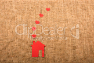 Hearts coming out of chimney of paper house