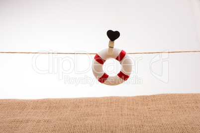 Life preserver attached to a string with heart