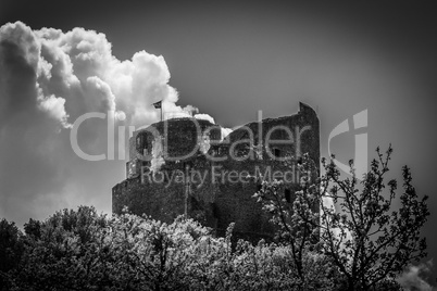 Ruins of medieval castle in Hungary, black and white.