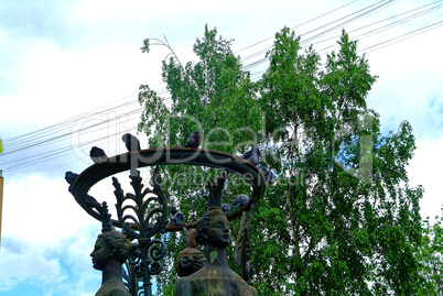 pigeons sitting on the heads of the statues