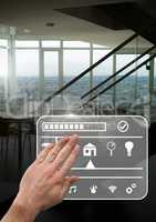 Hand touching smart home interface at home