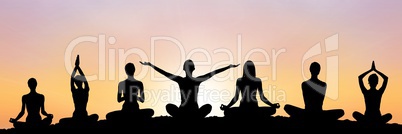 yoga group silhouette at sunset