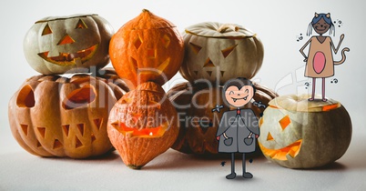 Cartoon children standing on halloween pumpkins
