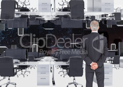 businessman standing in inverted office with skyline