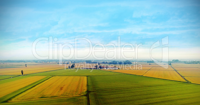Sky view of yellow and green grass field