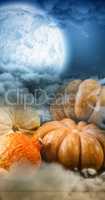 Composite image of pumpkins on wooden table