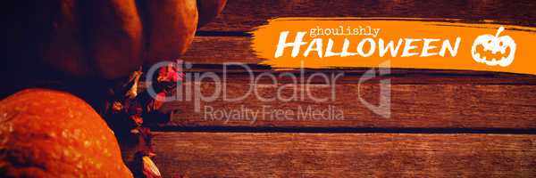 Composite image of graphic image of ghoulishly halloween text