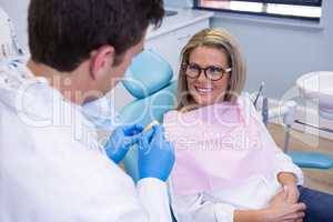 Patient talking with dentist at medical clinic
