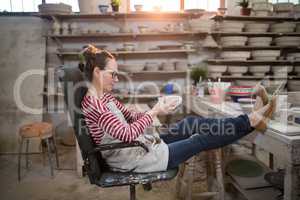 Woman sitting on chair checking bowl