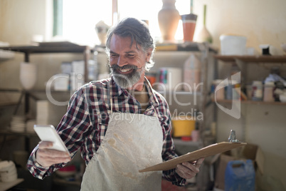 Happy potter using mobile phone