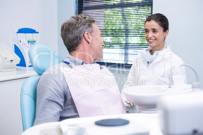 Female doctor talking with patient