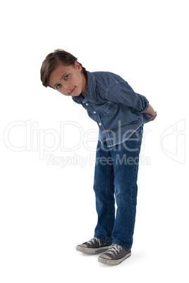 Boy standing against white background