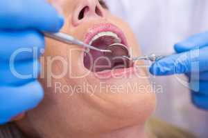 Dentist examining patient at medical clinic